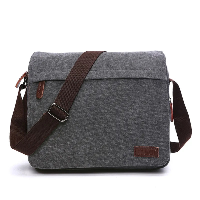 Gray canvas messenger bag with brown strap from Orin & Vale, minimalist design