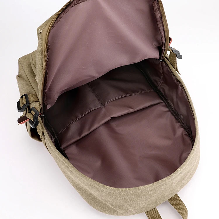 Orin & Vale spacious khaki canvas backpack open to show large brown interior compartment