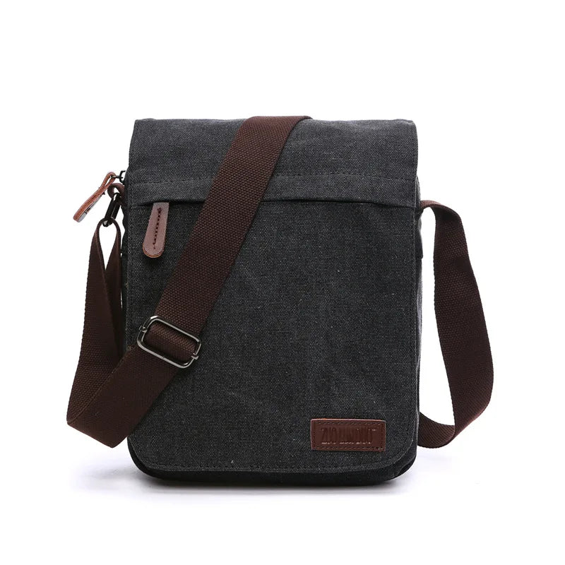 Black canvas crossbody bag with brown strap, Orin & Vale minimalist design