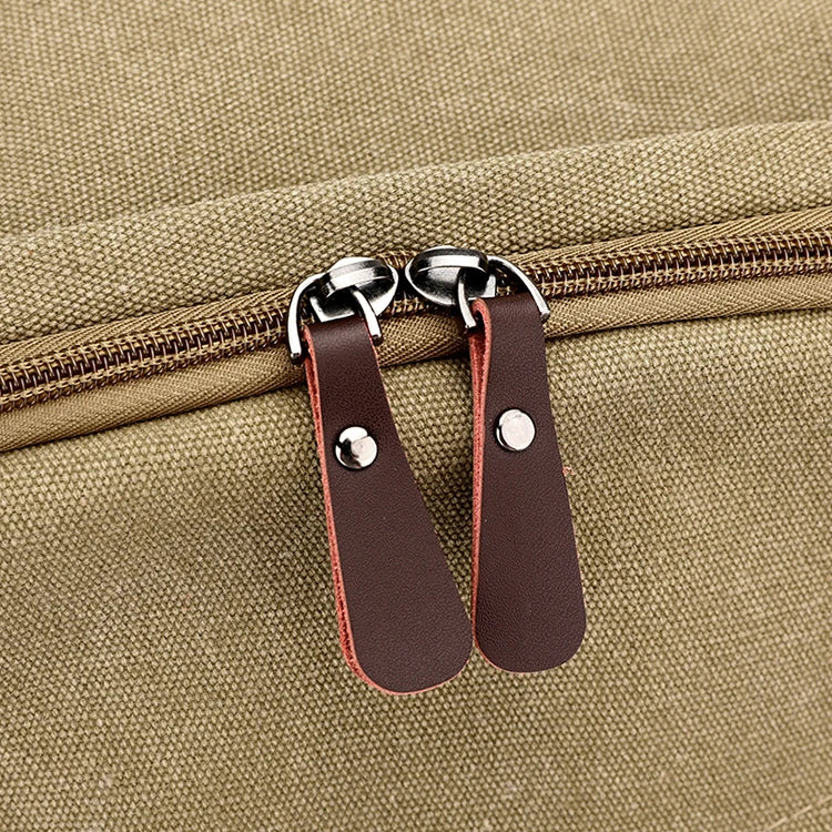 Close-up of brown canvas bag zipper with leather pulls by Orin & Vale