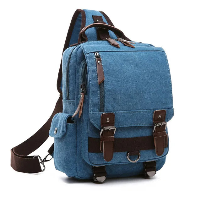 Blue canvas backpack with brown leather straps and multiple pockets from Orin & Vale