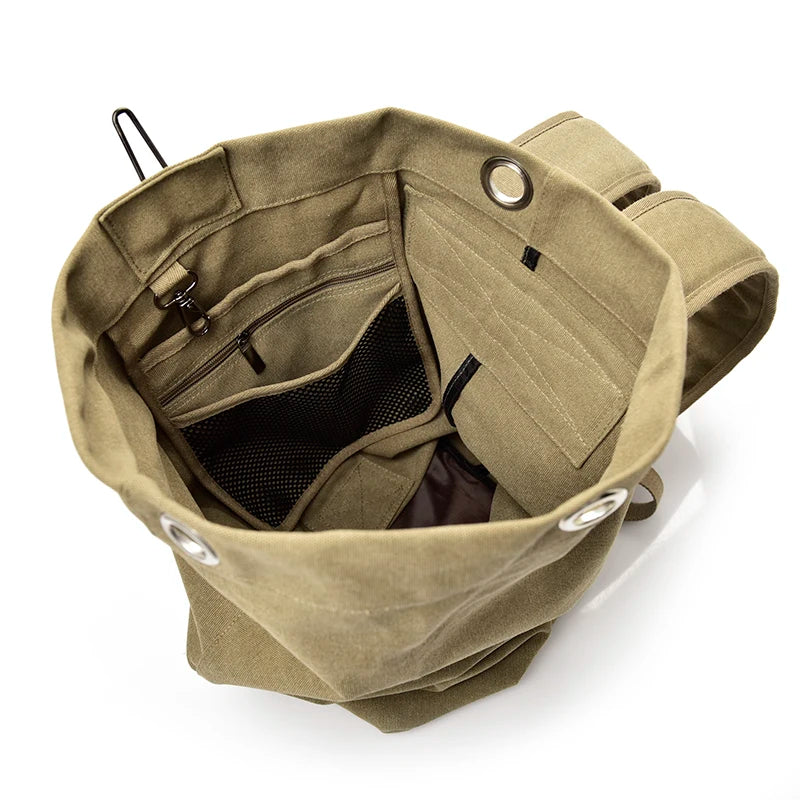 Interior view of khaki canvas backpack with multiple pockets and compartments by Orin & Vale