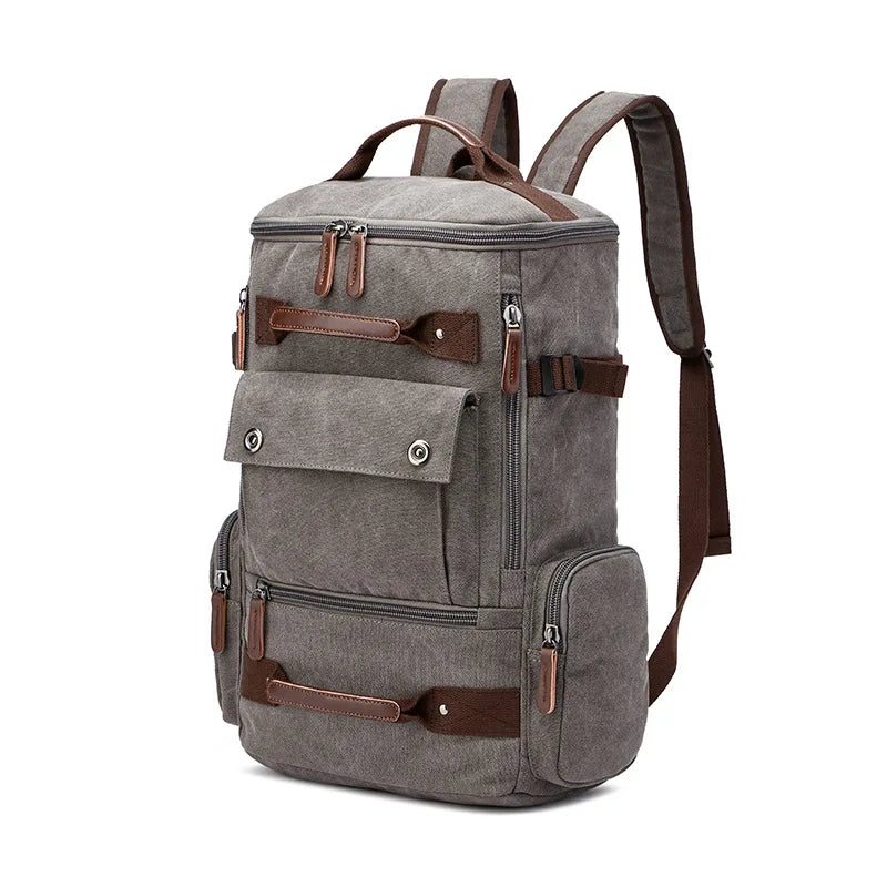 Orin & Vale gray canvas backpack with brown leather accents and multiple pockets.
