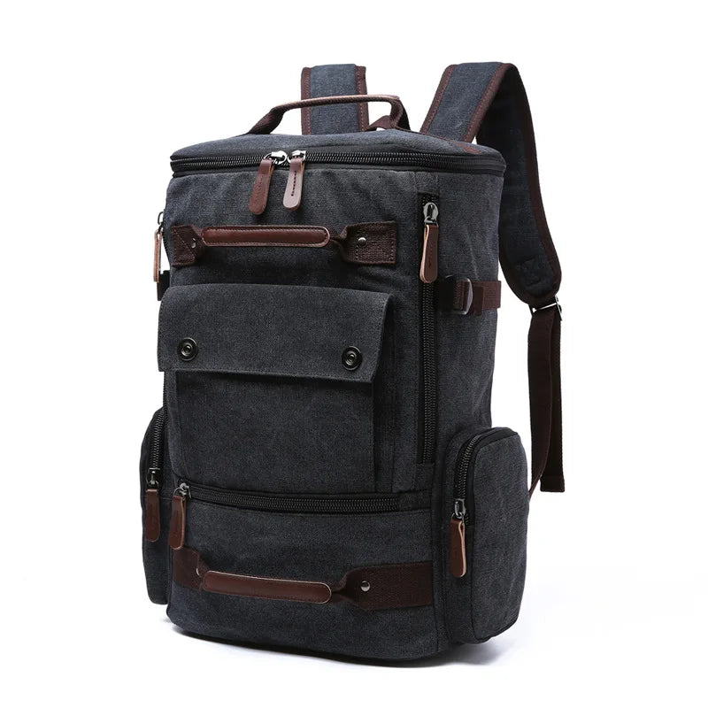 Dark grey Orin & Vale backpack with brown accents and multiple zippered compartments
