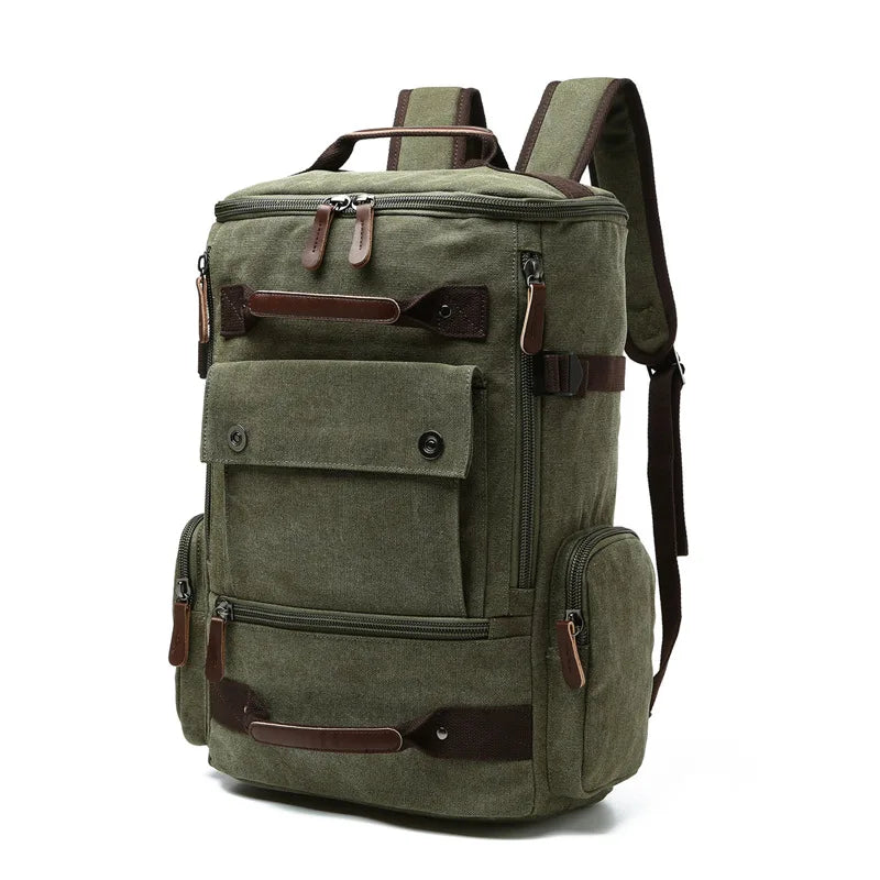 Olive green canvas backpack with front pocket, leather accents, and side zippers by Orin & Vale