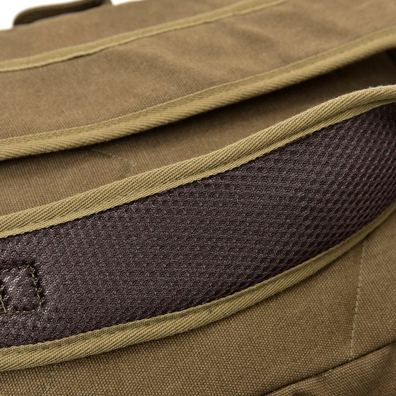 Close-up of brown canvas bag strap with mesh padding, Orin & Vale accessory