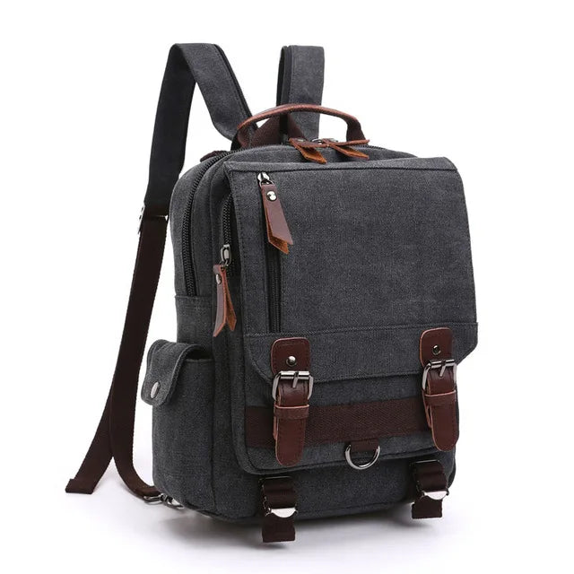 Dark gray canvas backpack with brown leather straps and metal buckles, Orin & Vale style