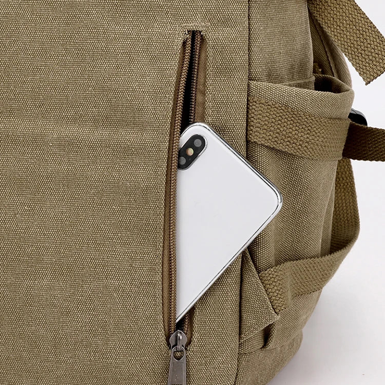 Tan canvas backpack from Orin & Vale with a smartphone in front zippered pocket