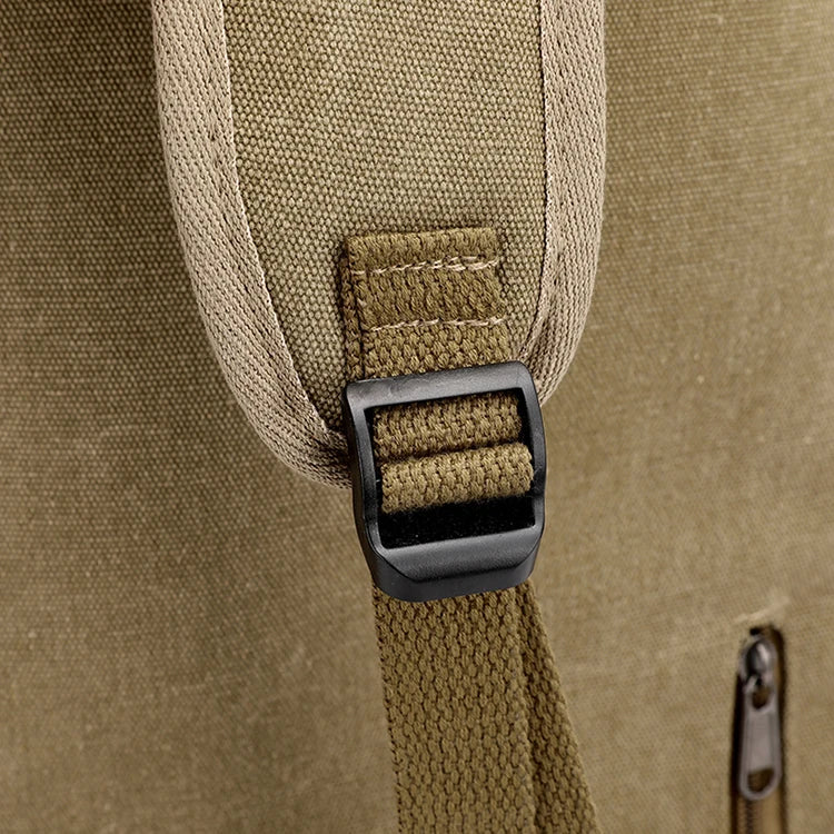 Close-up of khaki canvas backpack strap and buckle, Orin & Vale accessory detail